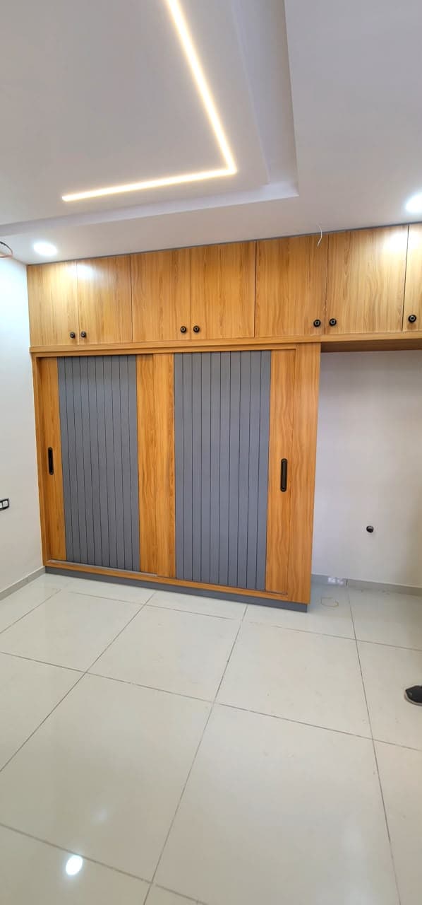 RAVYA wardrobe project — bespoke storage elevation.