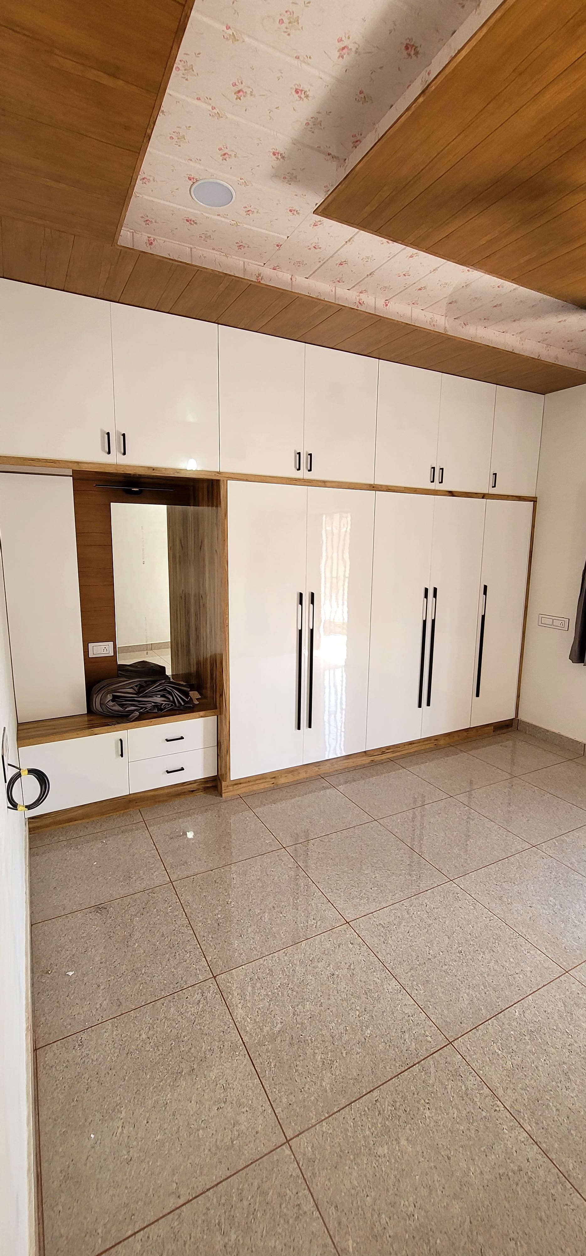 RAVYA wardrobe project — full-height storage installation.